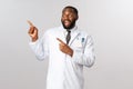 Covid19, healthcare and clinic concept. Charismatic, handsome african-american male doctor, physician or pharmacy clerk
