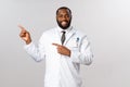Covid19, healthcare and clinic concept. Portrait of handsome smiling african-american doctor in white coat inviting