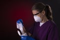 COVID-19 healthcare worker using PPE protective equipment and disinfectant wipes