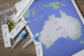 Covid home testing kits laying on a table next to a map of Australia Royalty Free Stock Photo