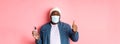 Covid-19, lifestyle and lockdown concept. Handsome african-american hipster man in face mask and beanie, showing hand Royalty Free Stock Photo