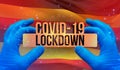 COVID-19 lockdown concept with backgroung of waving national flag of Uganda. Pandemic 3D illustration.