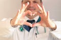 COVID-19. Male doctor`s hands show a heart sign. HIV protection concept. Doctor shows a heart symbol. Healthcare Royalty Free Stock Photo