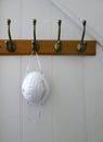 Covid-19 Mask hanging on coat hook