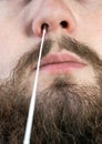 Covid-19 nasal swab test, taking nasal mucus test sample, Cotton swab from the throat and nose close-up Royalty Free Stock Photo