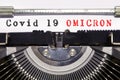 Covid-19 new Omicron variant. Conceptual words `Covid 19 Omicron` typed on vintage typewriter. Omicron B.1.1.529: SARS-CoV-2