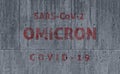 Covid-19 Omicron SARS-CoV-2 written on a dirty concrete wall