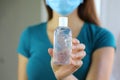 COVID-19 Pandemic Coronavirus Close up Woman Mask Hand Showing Alcohol Gel Sanitizer Dispenser Against 2019-nCoV. Antiseptic,