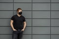 COVID-19 Pandemic Coronavirus Man in city street wearing face mask protective for spreading of Coronavirus Disease 2019. Portrait Royalty Free Stock Photo