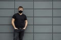 COVID-19 Pandemic Coronavirus Man in city street wearing face mask protective for spreading of Coronavirus Disease 2019. Portrait Royalty Free Stock Photo