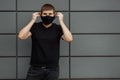 COVID-19 Pandemic Coronavirus Man in city street wearing face mask protective for spreading of Coronavirus Disease 2019. Portrait Royalty Free Stock Photo