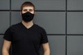 COVID-19 Pandemic Coronavirus Man in city street wearing face mask protective for spreading of Coronavirus Disease 2019 Royalty Free Stock Photo