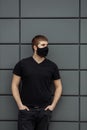 COVID-19 Pandemic Coronavirus Man in city street wearing face mask protective for spreading of Coronavirus Disease 2019 Royalty Free Stock Photo