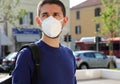 COVID-19 Pandemic Coronavirus Man in city street wearing KN95 FFP2 face mask protective for spreading of Coronavirus Disease 2019 Royalty Free Stock Photo