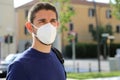 COVID-19 Pandemic Coronavirus Man in city street wearing KN95 FFP2 face mask protective for spreading of Coronavirus Disease 2019 Royalty Free Stock Photo