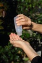 COVID-19 Pandemic Coronavirus woman hands using wash hand sanitizer gel dispenser, against Novel coronavirus 2019-nCoV or Wuhan