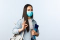 Covid-19 pandemic, education during coronavirus, back to school concept. Satisfied cute asian girl student in medical Royalty Free Stock Photo