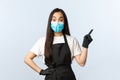 Covid-19 pandemic, social distancing, small business and preventing virus concept. Intrigued and surprised asian female