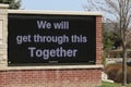 Covid 19 sign board message We Will Get Through This Together