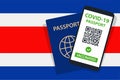 Covid-19 Passport on Costa Rica Flag Background. Vaccinated. QR Code. Smartphone. Immune Health Cerificate. Vaccination Document.