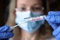 COVID-19 PCR test in doctor hands, nurse in face mask holding coronavirus swab collection kit