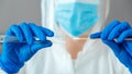 Covid 19 pcr test in nurse hands. Doctor in protective suit medical mask gloves holding Swab saliva sample for diagnostic covid19 Royalty Free Stock Photo