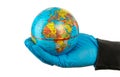 Covid 19 planet in hands with gloves. The pandemic concept. Earth globe. Isolated on white background