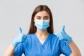 Covid-19, preventing virus, health, healthcare workers and quarantine concept. Close-up of supportive female nurse or