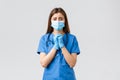 Covid-19, preventing virus, health, healthcare workers and quarantine concept. Hopeful desperate female nurse in blue