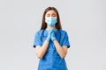 Covid-19, preventing virus, health, healthcare workers and quarantine concept. Hopeful female nurse or doctor in blue