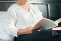 Covid-19 quarantine activity for senior woman read a book stay home to avoid risk Royalty Free Stock Photo