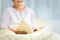 Covid-19 quarantine activity for senior woman read a book stay home to avoid risk Royalty Free Stock Photo