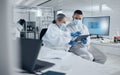 Covid research, tablet and science with a man and woman scientist working in a lab for innovation and healthcare Royalty Free Stock Photo