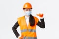 Covid-19 safety protocol at enterpise, construction and preventing virus concept. Confident asian female engineer in