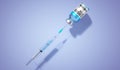 Covid-19 / SARS-CoV-2 / coronavirus vaccine ampoule and syringe, blue background Royalty Free Stock Photo