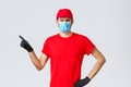 Covid-19, self-quarantine, online shopping and shipping concept. Displeased angry delivery guy scolding courier making Royalty Free Stock Photo