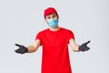 Covid-19, self-quarantine, online shopping and shipping concept. Friendly delivery man in face mask and gloves, reaching