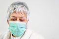 Covid-19. Senior woman portrait, wearing face protection mask, risk patient, protection against coronavirus flu and cold Royalty Free Stock Photo