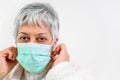 Covid-19. Senior woman portrait, wearing face protection mask, risk patient, protection against coronavirus flu and cold Royalty Free Stock Photo