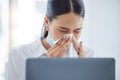 Covid, sick and blowing nose with a business woman sneezing into a tissue while suffering with a cold, flu or allergies Royalty Free Stock Photo