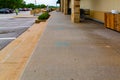 COVID 19; Social distancing blue floor marks entrance to a store