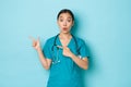 Covid-19, social distancing and coronavirus pandemic concept. Professional doctor, female nurse or physician in scrubs Royalty Free Stock Photo