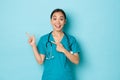 Covid-19, social distancing and coronavirus pandemic concept. Professional doctor, female nurse or physician in scrubs Royalty Free Stock Photo