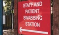 COVID-19 swabbing and testing station sign at a UK hospital