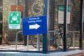 COVID-19 testing clinic sign on the street near the bike parking. Coronavirus outbreak Royalty Free Stock Photo