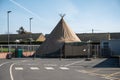 Covid 19 Testing and vaccination centre. Temporary tent structure enclosed behind metal fence