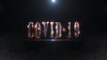 COVID-19 text animation zoomout with motion blur and fire burn effect follow COVID-19 text with drak backgound and lens flare. Royalty Free Stock Photo