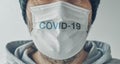 Covid-19 text on white surgical mask