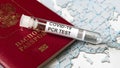 COVID-19, travel and test concept, tube for coronavirus PCR testing and Russian tourist passport