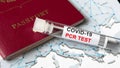 COVID-19, travel and test concept, tube for coronavirus PCR testing and tourist passport Royalty Free Stock Photo